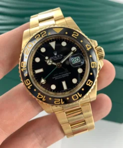 Alternative view of Rolex GMT-Master II “Root Beer” Yellow Gold Black Dial